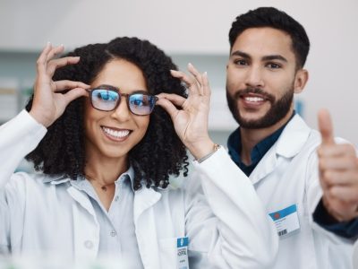 pharmacy-workers-portrait-thumbs-up-pharmacist-healthcare-wellness-staff-with-glasses-thank-you-teamwork-motivation-hand-sign-medical-workers-clinic-hospital-with-smile