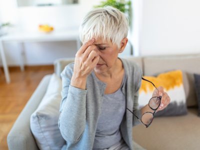 senior-woman-glasses-rubs-her-eyes-suffering-from-tired-eyes-ocular-diseases-concept